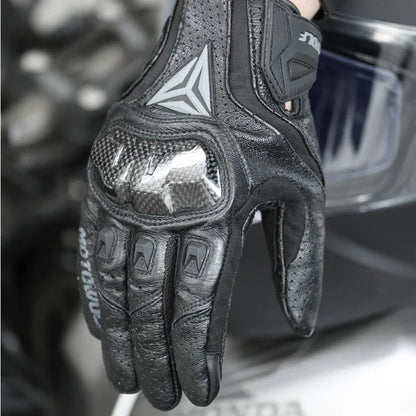 Motorcycle gloves black carbon knuckle close-up rider hand on bike